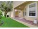 Brick paved patio with covered area and landscaping at 6943 Cupseed Ln, Harmony, FL 34773