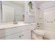 Bathroom featuring a white vanity, toilet, and bathtub at 6943 Cupseed Ln, Harmony, FL 34773