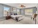 Large bedroom with carpeted floor and ceiling fan at 6943 Cupseed Ln, Harmony, FL 34773