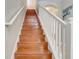 Clean lines and wood treads highlight this elegant staircase at 6943 Cupseed Ln, Harmony, FL 34773