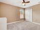 Bright bedroom with ceiling fan and neutral walls at 6943 Cupseed Ln, Harmony, FL 34773