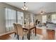 Bright dining area with hardwood floors at 6943 Cupseed Ln, Harmony, FL 34773