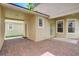 Brick paved patio with covered area and access to storage at 6943 Cupseed Ln, Harmony, FL 34773