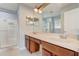 Double vanity bathroom with a large glass shower at 6943 Cupseed Ln, Harmony, FL 34773