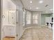 Clean bathroom with white vanity, new fixtures, and a window for natural light at 6943 Cupseed Ln, Harmony, FL 34773