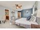 Primary bedroom with ensuite bathroom access and ample space at 6943 Cupseed Ln, Harmony, FL 34773