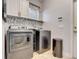 Laundry room with washer, dryer, and extra storage at 6943 Cupseed Ln, Harmony, FL 34773