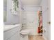 Clean bathroom with white vanity, bathtub, and shower at 6943 Cupseed Ln, Harmony, FL 34773