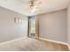 Bright bedroom with ceiling fan, carpet, and window at 6943 Cupseed Ln, Harmony, FL 34773