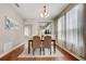 Elegant dining room featuring hardwood floors and a view into the kitchen at 6943 Cupseed Ln, Harmony, FL 34773