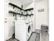 Laundry room with washer, dryer, and built-in shelving at 107 Julliard Blvd, Davenport, FL 33897