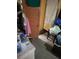 Small bedroom with door and flooring issues at 6936 Wilson Ave, Mulberry, FL 33860
