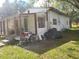 Small house with porch and yard, needs renovation at 6936 Wilson Ave, Mulberry, FL 33860