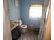 Bathroom with toilet, sink, and shower at 6936 Wilson Ave, Mulberry, FL 33860