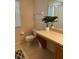 Bathroom with toilet, vanity, and a large mirror at 718 Verona Ave, Davenport, FL 33897