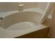 Oval bathtub with shower curtain in this bathroom at 718 Verona Ave, Davenport, FL 33897
