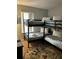 Bedroom with a bunk bed and themed rug at 718 Verona Ave, Davenport, FL 33897