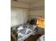 Bedroom with twin beds, nightstands, and striped walls at 718 Verona Ave, Davenport, FL 33897