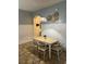 Charming dining area with a wooden table and modern chairs at 718 Verona Ave, Davenport, FL 33897