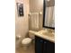 Bathroom with toilet, vanity, and decorative art at 718 Verona Ave, Davenport, FL 33897