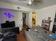 Bedroom with a bed, television, and access to the bathroom at 375 Lakepointe Dr # 101, Altamonte Springs, FL 32701