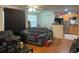 Open living room features a kitchen with a breakfast bar and hardwood floors at 375 Lakepointe Dr # 101, Altamonte Springs, FL 32701