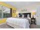 Spacious bedroom with king-size bed, nightstands, and window coverings at 3148 Pequod Pl, Kissimmee, FL 34746