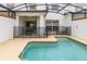 Enjoy this refreshing screened pool with patio seating at 3148 Pequod Pl, Kissimmee, FL 34746
