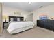 Comfortable bedroom featuring a king-size bed and dresser at 3148 Pequod Pl, Kissimmee, FL 34746