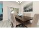Bright dining room with six-chair table and sliding glass doors at 3148 Pequod Pl, Kissimmee, FL 34746