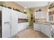 Well-equipped kitchen featuring granite countertops and white cabinetry at 384 Grand Canal Dr, Poinciana, FL 34759