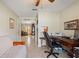 Home office with a desk, chair, and French doors opening to living room at 384 Grand Canal Dr, Poinciana, FL 34759
