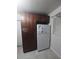 Kitchen with tall wooden cabinets and white refrigerator at 1520 Hill St, Kissimmee, FL 34741