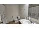Clean bathroom with a shower/tub combo, vanity, and tile flooring at 2585 Needlepoint St, Kissimmee, FL 34741