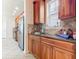 Kitchen with stainless steel appliances and wood cabinets at 1134 Tapestry Dr, Celebration, FL 34747