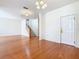 Hardwood floors and a view to the stairs highlight this dining area at 1134 Tapestry Dr, Celebration, FL 34747