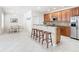 Bright kitchen with granite counters, stainless steel appliances, and wood cabinets at 1134 Tapestry Dr, Celebration, FL 34747