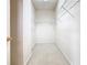 Large walk-in closet with wire shelving, carpeted floor and ample storage at 1134 Tapestry Dr, Celebration, FL 34747