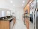 Modern kitchen featuring granite countertops and stainless steel appliances at 1134 Tapestry Dr, Celebration, FL 34747