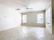 Spacious living room with tile floors and ample natural light from large windows at 1134 Tapestry Dr, Celebration, FL 34747