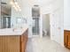 Main bathroom with double vanity, shower, and separate toilet area at 1134 Tapestry Dr, Celebration, FL 34747