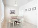 Bright dining area with wood table and white chairs at 1134 Tapestry Dr, Celebration, FL 34747