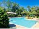 Relaxing pool area with a pergola and lush greenery at 1134 Tapestry Dr, Celebration, FL 34747