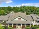 Community center with large covered porch and lush landscaping at 1134 Tapestry Dr, Celebration, FL 34747