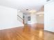 Open living space with hardwood floors and a staircase leading upstairs at 1134 Tapestry Dr, Celebration, FL 34747