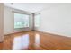 Spacious living area with hardwood floors and large windows offering natural light at 1134 Tapestry Dr, Celebration, FL 34747