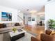 Spacious living room with hardwood floors, ample natural light, and comfortable seating at 1134 Tapestry Dr, Celebration, FL 34747