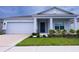 Curb appeal abounds at this charming one-story home with a two-car garage at 4791 Vellacito Way, Davenport, FL 33897