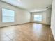 Bright and airy living room with tile flooring and neutral walls at 4791 Vellacito Way, Davenport, FL 33897