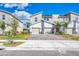 Modern townhouse exterior with paver driveway at 891 Ocean Course Ave # 0, Davenport, FL 33896
